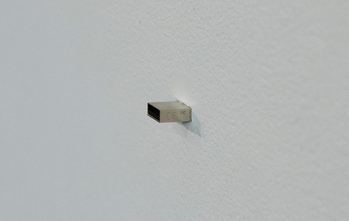 Jonathan Mayhew ‘Autoportrait’, USB flash drive embedded in a wall containing MP3, MP4, jpg, pdf, doc files, google search histories & everything Jonathan Mayhew could find via the internet about himself. 1x0.5x4cm 2017