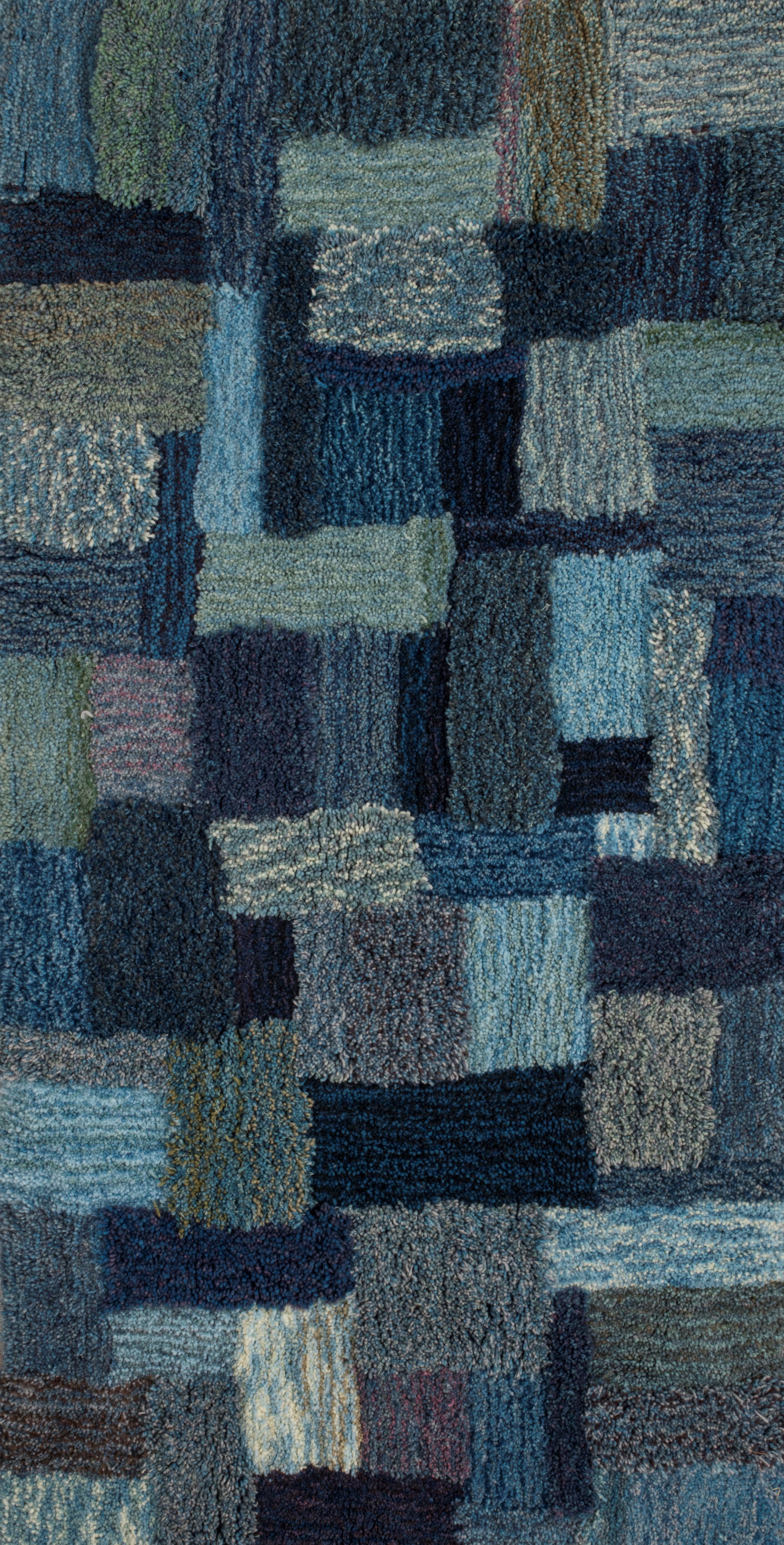 Natural Blues Carpet. Social project with indigo workshops - talking about sustainability in textiles, resulting to a growing carpet from dye samples. 2014-ongoing. Photo Marek Sabogal